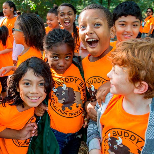 Group of kids enthusiastically posing for the camera